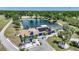 Stunning home featuring solar panels, a screened pool, and a tranquil pond, surrounded by mature trees at 24805 Nova Ln, Punta Gorda, FL 33980