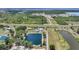 Vast property showcasing multiple ponds, a distant home, and extensive greenery in a peaceful setting at 24805 Nova Ln, Punta Gorda, FL 33980