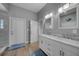 Bathroom featuring a double vanity sink with marble countertop and tile flooring at 24805 Nova Ln, Punta Gorda, FL 33980