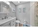 Modern bathroom featuring a stand-up shower with decorative tiles, and beach decor at 24805 Nova Ln, Punta Gorda, FL 33980