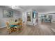 Dining area with wood table set, tile floors, and a TV at 24805 Nova Ln, Punta Gorda, FL 33980