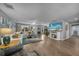 Spacious living area with modern finishes, including a large screen tv, comfortable seating, and great natural light at 24805 Nova Ln, Punta Gorda, FL 33980
