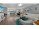 Inviting living room featuring a fireplace, modern decor, and seamless access to an open-concept kitchen at 24805 Nova Ln, Punta Gorda, FL 33980