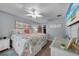 Comfortable main bedroom featuring a ceiling fan and beach decor at 24805 Nova Ln, Punta Gorda, FL 33980