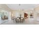 An open dining area connects to outdoor spaces and features bright natural light at 26 Saint Croix Way, Englewood, FL 34223