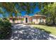 Charming single story home featuring a barrel tile roof and well manicured lawn at 26 Saint Croix Way, Englewood, FL 34223