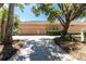 Spacious garage with an extended driveway and a barrel tile roof at 26 Saint Croix Way, Englewood, FL 34223