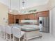 Modern kitchen features a large island with granite counters and stainless steel appliances at 26 Saint Croix Way, Englewood, FL 34223