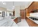 A kitchen with a center island, stainless steel appliances, and granite countertops at 26 Saint Croix Way, Englewood, FL 34223