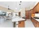 A kitchen with a center island, stainless steel appliances, and granite countertops at 26 Saint Croix Way, Englewood, FL 34223