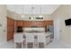 Modern kitchen features a large island with granite counters and stainless steel appliances at 26 Saint Croix Way, Englewood, FL 34223