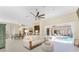 Spacious living room with tile floors, fireplace, access to the pool area, and views of the dining room at 26 Saint Croix Way, Englewood, FL 34223