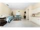 Open-concept living room with tile flooring, comfortable seating, and natural light at 26 Saint Croix Way, Englewood, FL 34223