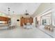 Open-concept living area with tile floors and an adjacent eat-in dining area at 26 Saint Croix Way, Englewood, FL 34223