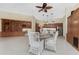 View of open concept floorplan including kitchen, dining area, and built-in shelving at 26 Saint Croix Way, Englewood, FL 34223