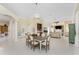 Bright, open-concept living space with formal dining area, tile floors, and expansive layout at 26 Saint Croix Way, Englewood, FL 34223