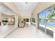 Enclosed patio with tile flooring and large sliding glass doors with lake views at 26 Saint Croix Way, Englewood, FL 34223