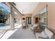 Covered patio featuring outdoor dining, lounging area and views of the screened-in pool at 26 Saint Croix Way, Englewood, FL 34223