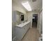 The bathroom features double sinks and a clean, neutral design, offering a spa-like experience at 2650 Colonade Ln, North Port, FL 34286