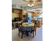 Enjoy casual meals in this inviting kitchen area, featuring ample cabinet space and plenty of natural light at 2650 Colonade Ln, North Port, FL 34286