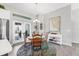 Cozy dining area adjacent to the kitchen featuring a round table and outdoor access at 27 Sportsman Cir, Rotonda West, FL 33947