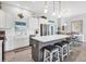 Chic kitchen featuring modern appliances, a center island with seating, and a seamless connection to the dining area at 27 Sportsman Cir, Rotonda West, FL 33947