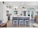 Modern kitchen with white cabinetry, stainless steel appliances, and a center island, providing ample space at 27 Sportsman Cir, Rotonda West, FL 33947