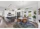 Inviting kitchen features stainless steel appliances, island with seating, and adjacent dining area at 27 Sportsman Cir, Rotonda West, FL 33947