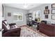 Comfortable office with a sofa, desk, neutral walls, carpet, and a window that provides plenty of natural light at 27 Sportsman Cir, Rotonda West, FL 33947