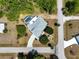 This aerial view reveals a home with a screened pool, well-kept landscaping, and a lengthy driveway at 270 E Wentworth St, Englewood, FL 34223