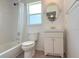 Bathroom featuring a bathtub, shower, vanity, and toilet at 270 E Wentworth St, Englewood, FL 34223