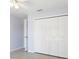 Bedroom featuring a ceiling fan, closet, and view to a doorway at 270 E Wentworth St, Englewood, FL 34223