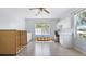 Bright bonus room with ample natural light, hardwood floors, and built in cabinets for storage and workspace at 270 E Wentworth St, Englewood, FL 34223