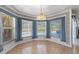 Bright breakfast nook featuring tile flooring, custom window treatments, and views of the outdoor pool and landscaping at 270 E Wentworth St, Englewood, FL 34223