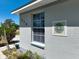 Close-up view of the house number with decorative tile art on the exterior wall at 270 E Wentworth St, Englewood, FL 34223