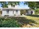 Inviting two-story home featuring well-manicured landscaping and classic architectural details for curb appeal at 270 E Wentworth St, Englewood, FL 34223