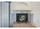 Decorative fireplace with a unique tile surround and hearth at 270 E Wentworth St, Englewood, FL 34223