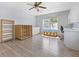 Versatile flex room with wood floors, window views, and built in storage and cabinetry at 270 E Wentworth St, Englewood, FL 34223