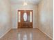 Welcoming foyer with tile flooring and a beautiful front door, creating a warm and inviting entrance at 270 E Wentworth St, Englewood, FL 34223