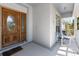 Charming front porch featuring comfortable seating and scenic views, perfect for relaxing or entertaining guests at 270 E Wentworth St, Englewood, FL 34223