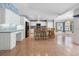 Open-concept kitchen featuring an island with bar stools and ample cabinet space at 270 E Wentworth St, Englewood, FL 34223