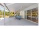 Lanai providing cover for outdoor dining, leading to a backyard with a pool at 270 E Wentworth St, Englewood, FL 34223