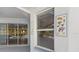 Lanai with decorative fish themed accents, and glass doors showcasing screened in patio and pool area at 270 E Wentworth St, Englewood, FL 34223