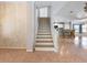 Bright living room featuring open floor plan and staircase, perfect for entertaining or relaxing with Gathering at 270 E Wentworth St, Englewood, FL 34223
