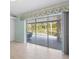 Spacious patio with outdoor seating visible through sliding glass doors and white wood flooring at 270 E Wentworth St, Englewood, FL 34223