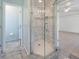 Bathroom features a glass-enclosed shower with marble tile and a built-in niche at 270 E Wentworth St, Englewood, FL 34223