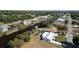 Aerial view of waterfront homes along a canal, some with docks, boats, and screened pools at 3246 Yukon Dr, Port Charlotte, FL 33948