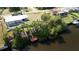 Waterfront home featuring a screened pool, dock, and easy access to the open water at 3246 Yukon Dr, Port Charlotte, FL 33948