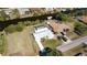 Aerial view of a home on the water with a pool at 3246 Yukon Dr, Port Charlotte, FL 33948