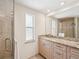 Bright bathroom featuring granite countertop, modern sink, and shower with glass door at 3246 Yukon Dr, Port Charlotte, FL 33948